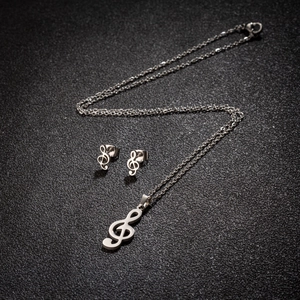 Parure musicale en acier inoxydable avec collier pendentif clé de sol et boucles d'oreilles