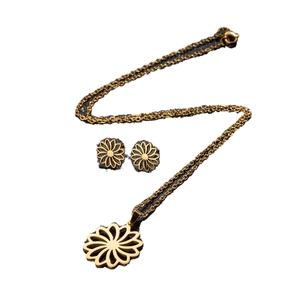 Elegant gold hollow flower jewelry set with pendant necklace and matching stud earrings