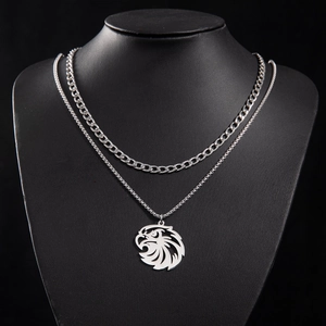 Close-up of double-layer stainless steel necklace with eagle pendant and cuban chain