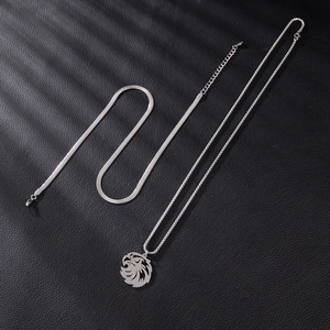 Double-layered stainless steel necklace featuring a punk eagle pendant on black leather background