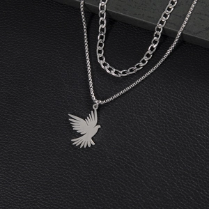 Double-layered stainless steel necklace featuring a vintage eagle pendant and cuban chain