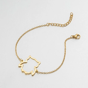 Detail of gold penguin cutout pendant bracelet with adjustable link chain and clasp