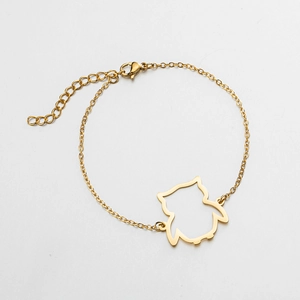 Detailed view of gold owl pendant bracelet with adjustable extension chain and lobster clasp