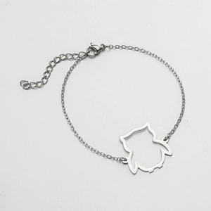 Detail view of silver hollow owl pendant on adjustable stainless steel O-chain bracelet