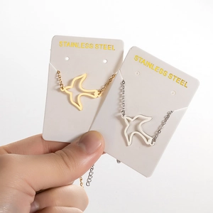 Minimalist stainless steel hollow bird pendant necklace in gold and silver finish