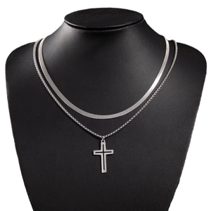 Gothic double layer silver necklace with minimalist cross pendant on a black bust model