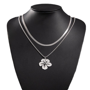 Double-layered stainless steel necklace featuring a snake chain and flower pendant