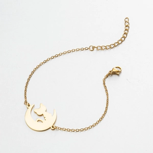 Detailed view of gold moon cat pendant bracelet with lobster clasp and extension chain