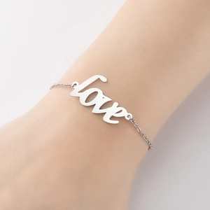 French vintage silver love pendant bracelet for women on elegant model wrist