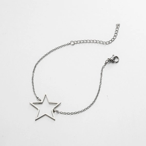 Detail of silver stainless steel star bracelet with hollow star pendant and lobster clasp