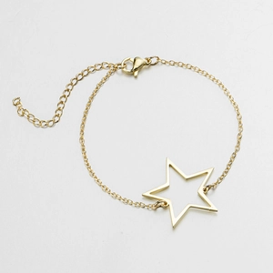 Detail view of gold stainless steel bracelet with hollow star charm and lobster clasp closure
