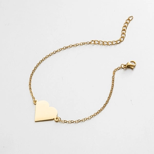 Detailed view of heart pendant bracelet with lobster clasp and adjustable gold chain
