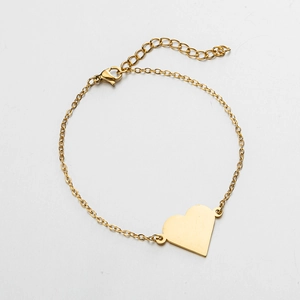 Detail view of 18K gold plated heart pendant bracelet with lobster clasp and extender