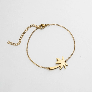 Detail of tropical palm tree pendant on adjustable gold chain with lobster clasp closure