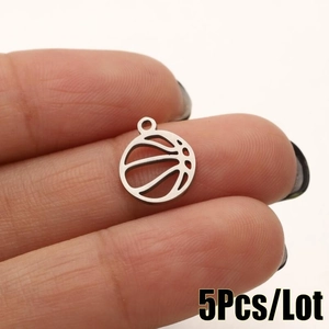 Detailed macro view of 5 silver stainless steel basketball charms for DIY jewelry making