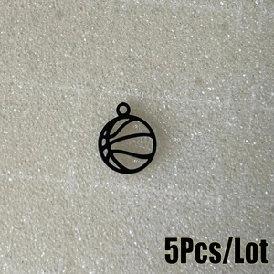 Detailed macro view of five matte black hollow basketball charms with top hanging loops