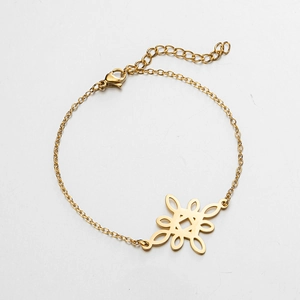 Detail of gold witch's knot pendant with lobster clasp and adjustable chain link