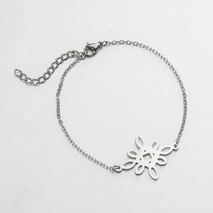 Detail of silver stainless steel bracelet featuring a Chinese knot charm and lobster clasp