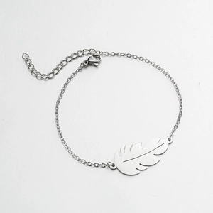 Close-up of leaf pendant bracelet with adjustable lobster clasp on white background