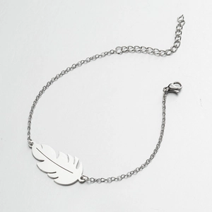 Elegant silver feather pendant bracelet with adjustable stainless steel chain on white background