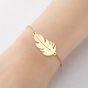 Minimalist gold leaf feather pendant bracelet on a delicate chain for women's jewelry