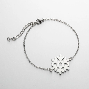 Detailed view of silver snowflake pendant bracelet with lobster clasp and extension chain