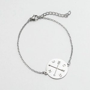 Minimalist stainless steel compass pendant bracelet with hollow arrow design and 18K gold finish