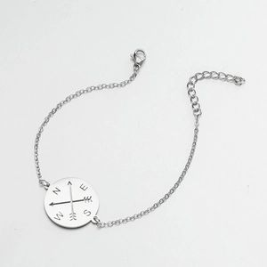 Detail of silver compass pendant bracelet with lobster clasp and adjustable extension chain