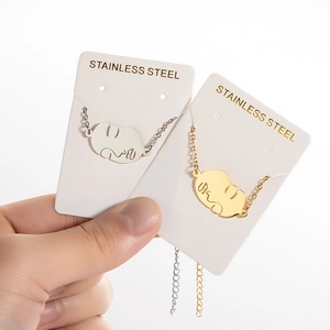 Bracelets avec pendentif visage abstrait en acier inoxydable doré et argenté design