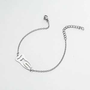 Detail view of silver tooth pendant bracelet with lobster clasp and extension chain