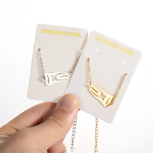 Fashionable stainless steel tooth pendant bracelets in gold and silver finishes