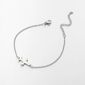 Detail of silver airplane pendant on thin chain with adjustable lobster clasp closure