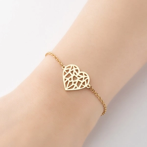 Minimalist gold geometric hollow heart bracelet with fine chain link on female wrist