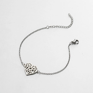 Detail of silver hollow heart charm bracelet with lobster clasp and adjustable link chain