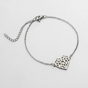 Minimalist silver stainless steel bracelet featuring a geometric hollow heart-shaped pendant