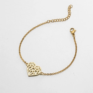 Detail of 18K gold plated stainless steel bracelet with geometric hollow heart charm