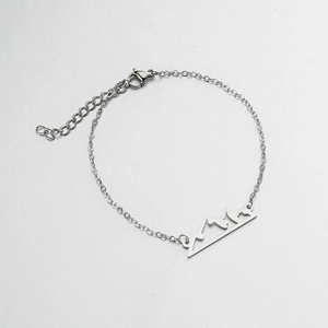 Minimalist stainless steel chain bracelet featuring a hollow mountain peak pendant design