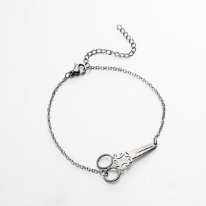 Gothic punk silver stainless steel bracelet featuring a detailed scissor charm and chain