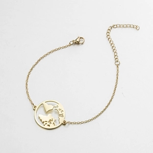 Golden stainless steel chain bracelet featuring a hollow round world map map pendant