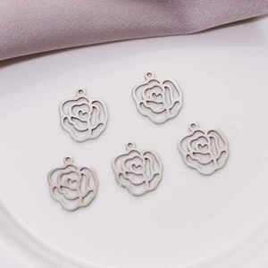 Detailed macro view of five hollow rose flower pendants with heart-shaped centers