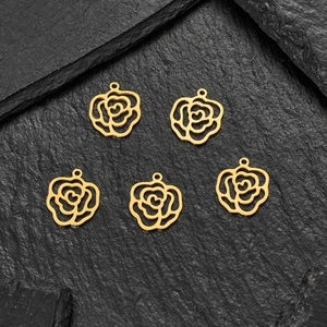 Detailed view of 5-piece gold-tone rose flower pendants with hollow heart center for DIY