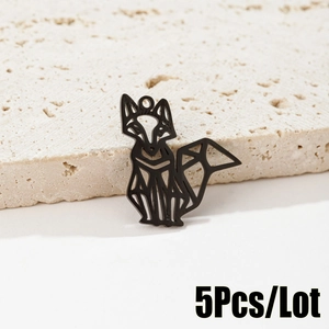 Detailed view of 5-piece black geometric hollow fox pendants on a stone display base