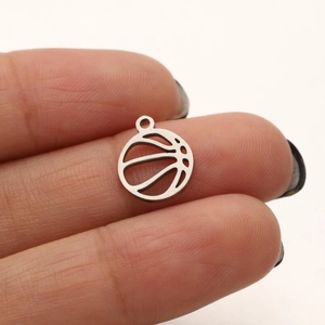 Detailed close-up of a hollow basketball pendant in polished stainless steel for jewelry