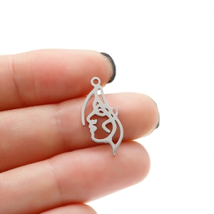 Detail of minimalist stainless steel portrait pendant for DIY jewelry making