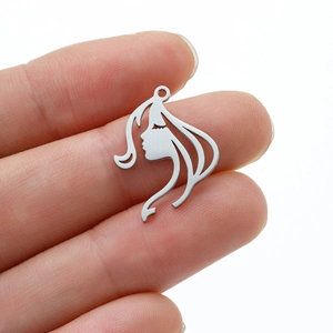 Minimalist stainless steel face silhouette pendant showing fine hollow cut craftsmanship