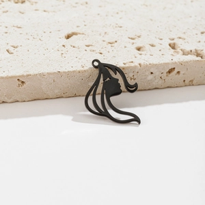 Detailed view of matte black geometric female face silhouette pendant for DIY jewelry