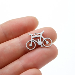 Macro view of a bicycle-shaped stainless steel pendant for custom jewelry DIY