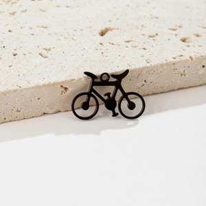 Macro detail of bicycle pendant with black plating and hollowed-out metal frame