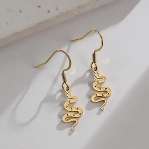 Golden zodiac snake dangle earrings in polished stainless steel with intricate cutouts