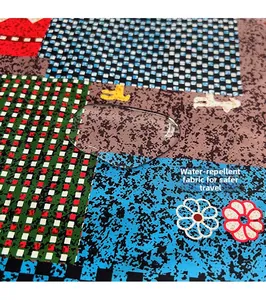 Close-up of water-repellent canvas fabric with colorful geometric patchwork patterns